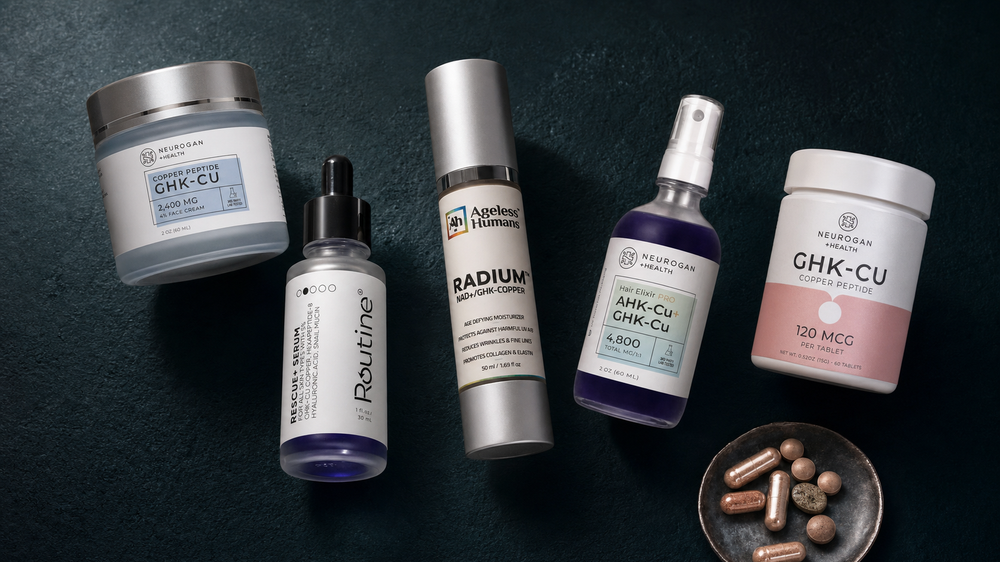 GHK-Cu copper peptide skincare collection — Novaglo Labs GHK-Cu Advanced Cream, Rescue+ Multi-Peptide Serum, Radium NAD+ cream, AHK-Cu hair serum, and GHK-Cu copper peptide tablets arranged on dark background
